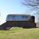 The ramp provided allowed the farmer to pull hay wagons and other pieces of farm equipment into the barn for storage.