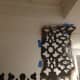 Because I was unable to use the smaller stencil provided by the manufacturer, I had to tape the stencil up and onto the ceiling.