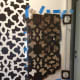 I needed to use a lot of tape to keep the stencil flush to the wall. Working around the door moulding was tricky.