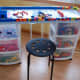 This DIY Lego Table created by www.ourweefamily.blogspot.com was made by placing a board on top of rolling storage bins which store all the Legos.