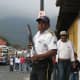Private security guard with shotgun, guarding a bank in Antigua Guatemala.