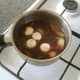 Chicken stock and red wine complete the soup's ingredients