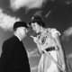Fort Wayne Daisies player, Marie Wegman, of the All American Girls Professional Baseball League and umpire Norris Ward. April 1948.
