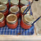 Gently move each jar to your canner, and fill to 2 inches above your jars.