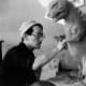 Teizo Toshimitsu sculpting a Godzilla prototype design.
