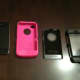 From left to right: iPhone 4, OtterBox Defender soft silicone shell, OtterBox Defender back hard plastic cover and the OtterBox Defender front hard plastic cover.