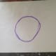 1. On wax paper, trace an outline of the Saturn yarn ball's middle section.