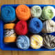 Select yarn colors for each planet. Use the planet color chart from the mini clay project above.