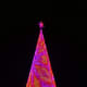 Mile High Tree in Denver, Colo. with purple and orange lighting pattern.