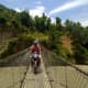 It is exciting to ride a motorbike on a suspension bridge. 