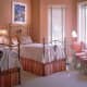 All Coral Wall Theme with Coral/White Bedding.