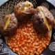 Jacket Potatoes stuffed with a slice of Cheddar Cheese and served with baked beans.