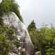 Take the unmarked side trail up and climb the rock. Be careful - it's steep and you'll need to watch your footing.