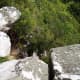 This picture does not do the steepness of this picture justice - at all. Toward the bottom left, the first brown landing is about 5 feet below the rocks. It descends steeply from there.
