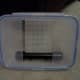 Face plate (lid) attached to scrubber with scrubber screen mounted inside