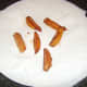 Sweet potato fries are dried on kitchen paper