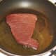 Starting to fry tuna steak