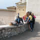 Students enjoying riposo on the retaining wall near the main entrance to St. Francis upper Basilica.