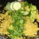 Cucumber and coriander/cilantro added to duck leg biryani