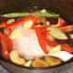 Duck leg casserole ready to be covered for the oven