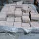 c. Paver squares in plastic packaging.
