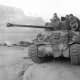 A British Sherman tank with 17 pound main gun used to battle heavier German tanks guarding a bridge over the Meuse River during the Battle of the Bulge.