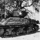 The main American battle tank the M-4 Sherman medium tank not a match for the German Tiger tank. American leaders based their hopes of overwhelming the battlefield with their Sherman tanks, over 50,000 had been produced by the end of 1944.