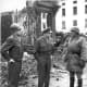 Bradley, Eisenhower and Patton (right) in Bastogne, Belgium, 1945, surveying the damage.