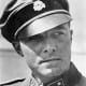 Colonel Jochim Peiper in his 1st SS Panzer Division &quot;Leibstandarte&quot; Adolf Hitler uniform. The Death's Head insignia on his cap signifies loyalty to the death for the Fuhrer Adolf Hitler. He spoke excellent English.  
