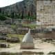 Omphalos of Delphi. This was supposed to be the naval of the world. The Delphic Oracle, the Pythia, would prophesy while touching it.