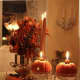 Use pumpkins and gourds as candle holders.
