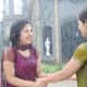 Divya and Nivedita dancing in the rain thinking of Siddharth