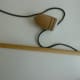 Whip and top: a wooden spinning top and stick with a leather lace