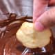 Dip the cooled butter cookies into the chocolate ganache for decoration.
