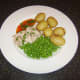 Sweet chilli sauce and coriander/cilantro garnish the poached chicken leg meal