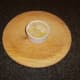 Melted butter is poured in to ramekin with chicken