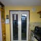 New door on the opposite side of the kitchen to where the original back door was.