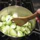 Olive oil, garlic and tomatoes. Note the bamboo spatula! Love it.