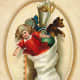 Vintage Christmas cards: Christmas stocking filled with antique toys and doll