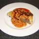A Forfar Bridie served with baked beans in tomato sauce and HP Sauce