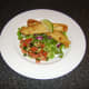 Battered and deep fried fillets of basa fish with salad