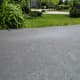  Use a pressure washer to clean driveways before sealing