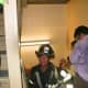 Fireman Mike Kehoe heads upstairs while others flee downstairs. Kehoe luckily survived the building collapses.
