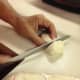 Slice the dough into strips, and then cut the strips into biscuit size.