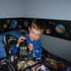 Our 7 year old son is quite happy about his new space-themed bedroom!