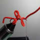 Forming the second worm's loop.