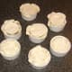 Lids are fitted to mini puff pastry pies