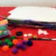 Use supplies you may already have around the house that you might normally throw away, like tissue paper and old buttons.