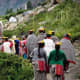 The villagers going to receive the flower gatherers