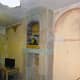 Living room cleared, walls stripped and fireplace tiled